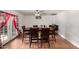 Formal dining area features a wooden dining table, six chairs, and elegant decor, great for entertaining at 1602 N 73Rd Ave, Phoenix, AZ 85035