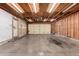 Spacious garage with overhead lighting, and concrete flooring offering ample parking at 1602 N 73Rd Ave, Phoenix, AZ 85035
