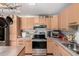 Close up of kitchen with stainless steel appliances, plenty of cabinets and storage space at 1602 N 73Rd Ave, Phoenix, AZ 85035