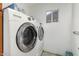 Laundry room with Samsung washer and dryer and a small window for ventilation at 1602 N 73Rd Ave, Phoenix, AZ 85035
