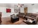 This cozy living room features a plush reclining sofa, ottoman, and a ceiling fan for added comfort at 1602 N 73Rd Ave, Phoenix, AZ 85035