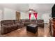 This cozy living room features plush reclining sofas, an ottoman, and textured walls for added comfort at 1602 N 73Rd Ave, Phoenix, AZ 85035