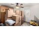 Storage room filled with boxes near an exterior access door and a ceiling fan at 1602 N 73Rd Ave, Phoenix, AZ 85035