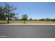 View of a neighborhood green space or park, a well-maintained grassy field with mature trees at 16233 N 32Nd Ave, Phoenix, AZ 85053