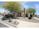 View of the front of the home, landscaped with mature shade trees, flowers, and rock at 16233 N 32Nd Ave, Phoenix, AZ 85053
