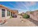 Backyard view showcasing a covered patio, plants, and ample space for outdoor activities at 1633 E Jasmine St, Casa Grande, AZ 85122