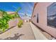 Backyard featuring a gravel surface with a side patio at 1633 E Jasmine St, Casa Grande, AZ 85122