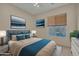 Relaxing bedroom featuring a comfortable bed, stylish decor, and plenty of natural light at 1633 E Jasmine St, Casa Grande, AZ 85122