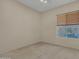 Bright bedroom with a large window and neutral decor providing a blank slate at 1633 E Jasmine St, Casa Grande, AZ 85122