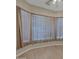 Well-lit bedroom with large window, allowing ample natural light to filter in at 1633 E Jasmine St, Casa Grande, AZ 85122