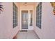 Covered front entry with a decorative door and sidelight windows at 1633 E Jasmine St, Casa Grande, AZ 85122