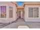 Inviting entryway with decor, potted plants and a solid door at 1633 E Jasmine St, Casa Grande, AZ 85122