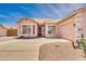 Single-story home with a concrete driveway and desert landscaping at 1633 E Jasmine St, Casa Grande, AZ 85122
