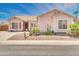 Single-story home with desert landscaping, including cacti and palm trees at 1633 E Jasmine St, Casa Grande, AZ 85122