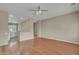 Open floor plan featuring wood floors, ceiling fan and neutral paint at 1633 E Jasmine St, Casa Grande, AZ 85122