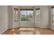 Charming living room bay window showcasing a view of the lush backyard at 1633 E Jasmine St, Casa Grande, AZ 85122