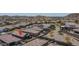 Aerial view of the neighborhood with mature landscaping and pool at 16500 W Caldwell St, Goodyear, AZ 85338