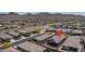 Aerial view showcasing neighborhood with landscaped yards and mountain backdrop at 16500 W Caldwell St, Goodyear, AZ 85338