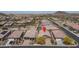 Bird's eye view of a neighborhood showcasing well-kept homes and desert landscape at 16500 W Caldwell St, Goodyear, AZ 85338