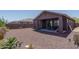 Backyard with covered patio and easy care desert landscaping at 16500 W Caldwell St, Goodyear, AZ 85338