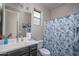 Well-maintained bathroom with a vanity and patterned shower curtain at 16500 W Caldwell St, Goodyear, AZ 85338