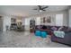 Open-concept living room and dining area with modern furnishings, neutral tones, and ample natural light at 16500 W Caldwell St, Goodyear, AZ 85338