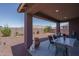 Spacious covered patio with backyard views and outdoor seating at 16500 W Caldwell St, Goodyear, AZ 85338