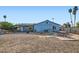 Expansive backyard with a covered patio, barbecue grill, and ample space at 1657 N 55Th Ave, Phoenix, AZ 85035