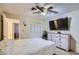 Bedroom featuring a ceiling fan and an ensuite bathroom at 1657 N 55Th Ave, Phoenix, AZ 85035