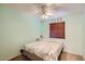 Cozy bedroom featuring a ceiling fan and a comfortable bed with a Paris-themed duvet cover at 1657 N 55Th Ave, Phoenix, AZ 85035