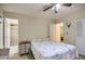 Bedroom featuring a ceiling fan and ensuite bathroom at 1657 N 55Th Ave, Phoenix, AZ 85035