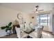 Elegant dining room featuring a modern glass table, seating for six, and stylish decor at 1657 N 55Th Ave, Phoenix, AZ 85035