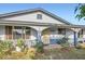Cozy front porch with decorative plants, creating a warm and welcoming entrance at 1657 N 55Th Ave, Phoenix, AZ 85035