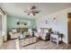 Bright living room featuring hardwood floors, neutral-toned furniture, and a cozy ambiance at 1657 N 55Th Ave, Phoenix, AZ 85035