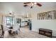 Spacious living room and open kitchen featuring wood-look tile floors at 1657 N 55Th Ave, Phoenix, AZ 85035