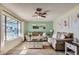 Bright living room featuring hardwood floors, neutral-toned furniture, and a cozy ambiance at 1657 N 55Th Ave, Phoenix, AZ 85035