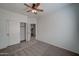 Cozy bedroom with carpet flooring, ceiling fan, closet and neutral color palette at 171 W Hawaii Dr, Casa Grande, AZ 85122