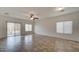 Spacious living room with tile floors, ceiling fan, and ample natural light from the windows at 171 W Hawaii Dr, Casa Grande, AZ 85122