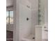 Walk-in shower features glass block and white tile at 17878 N 114Th Ln, Surprise, AZ 85378
