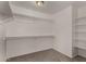 Large walk-in closet with ample shelving and storage space at 17878 N 114Th Ln, Surprise, AZ 85378
