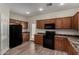 Fully equipped kitchen with modern appliances and wood cabinets at 17878 N 114Th Ln, Surprise, AZ 85378