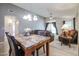 Dining area with elegant lighting and a marble-top table, seamlessly connected to the spacious living area at 18116 N Catherine Dr, Surprise, AZ 85374