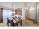 Inviting dining room with marble table, stylish chairs, and natural light filtering through window at 18116 N Catherine Dr, Surprise, AZ 85374