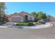 Charming single-story home with a well-maintained front yard and attached two-car garage at 18116 N Catherine Dr, Surprise, AZ 85374