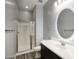 Modern bathroom featuring glass shower, LED mirror, and wood-look tile flooring at 18175 W Highland Ave, Goodyear, AZ 85395