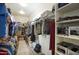 Walk-in closet featuring lots of storage and shelving with an organized design at 18175 W Highland Ave, Goodyear, AZ 85395