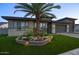 Well-kept home with desert landscaping and lighting, with a neat artificial lawn at 18175 W Highland Ave, Goodyear, AZ 85395