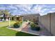 Large backyard with mature landscaping, raised garden beds, and a view of the swimming pool at 18175 W Highland Ave, Goodyear, AZ 85395