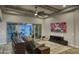 Inviting living room with backyard views, a ceiling fan, and a comfortable, modern entertainment area at 18175 W Highland Ave, Goodyear, AZ 85395