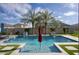 Sparkling pool is surrounded by pavers, artificial turf, fire features, and mature landscaping at 18175 W Highland Ave, Goodyear, AZ 85395